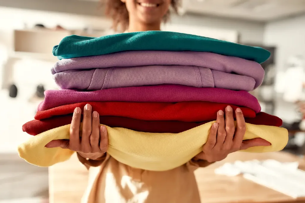 Colorful clothes being held